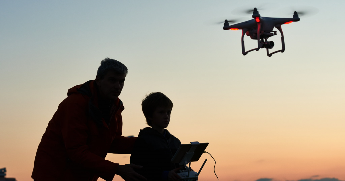 Father and a son flying a drone (Photo: Shutterstock)