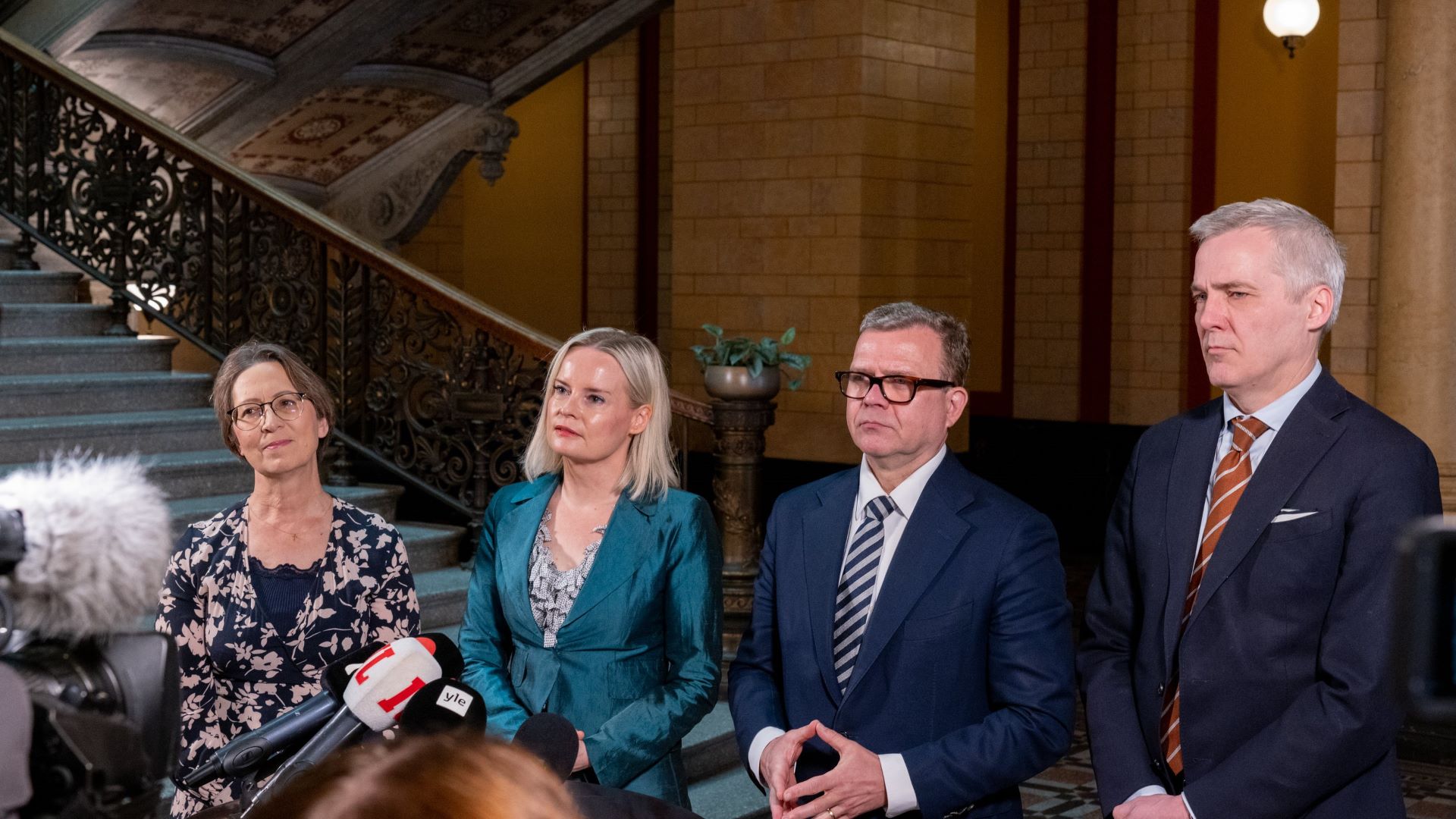 Leaders of the government parties meet the media ahead of the spending limits negotiations.