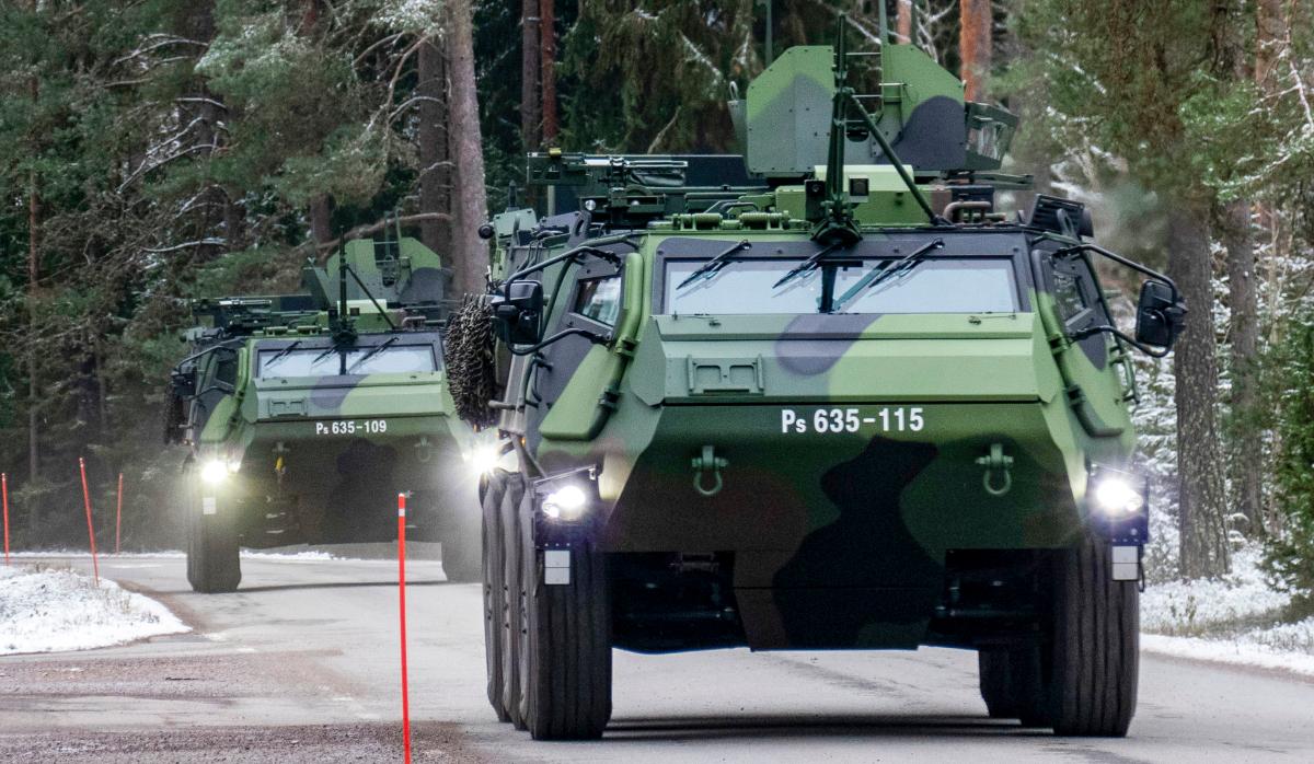 Two XA-300 armoured personnel carriers driving on the road.