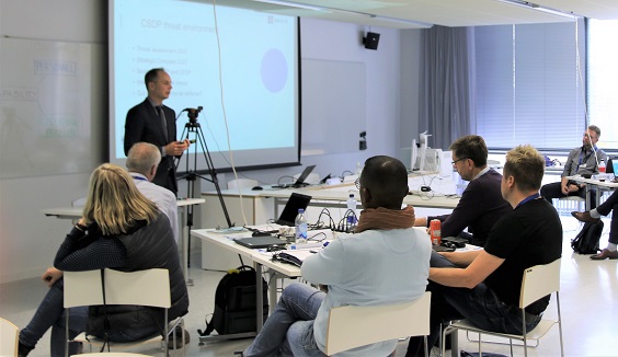 Students sitting in a class room listening to a speaker