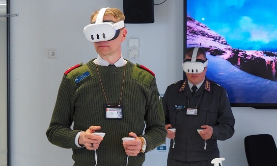 Two officers in military uniform wearing virtual reality googles